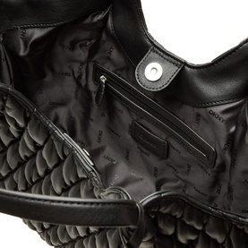 DKNY Paula Quilted Medium Tote Bag in black, open interior view showing logo lining, zip pocket and silver-tone magnetic snap fastening
