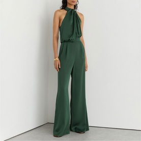 Model wearing Reiss teal green halterneck wide-leg jumpsuit with tie neck detail and fluid fabric