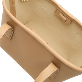Marella camel tote bag interior view showing structured open top, cream lining, and gold-tone hardware details.