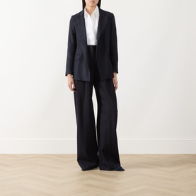 Model wearing Marella navy plain wool blazer with matching wide-leg trousers and white shirt underneath