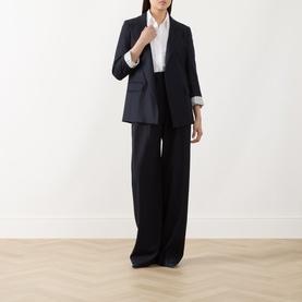 Model wearing Marella navy plain wool blazer, styled with matching wide-leg trousers and white shirt.