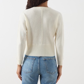 Model wearing Marella Manto Knitted Cardigan in cream wool-cashmere blend, back view, styled with blue denim jeans.