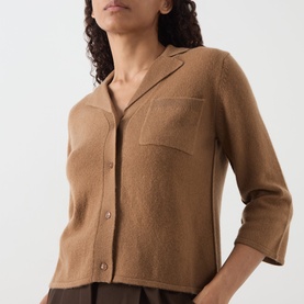 Model wearing Marella Alpaca Knitted Polo Cardigan in camel with notch lapel, three-quarter sleeves, chest patch pocket and front button fastening