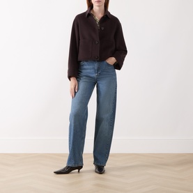 Model wearing Marella brown wool-blend cropped coat with button front, styled with blue straight-leg jeans and black kitten heel boots.