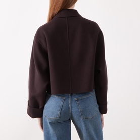 Model wearing Marella brown cropped wool coat, back view, with rolled cuffs, styled with light blue jeans