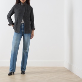 Model wearing Marella melange dark wool coat, styled with light blue straight-leg jeans and black loafers.