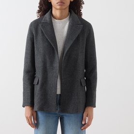 Model wearing Marella melange dark wool coat with notched lapels and welt pockets, styled with grey knit and blue jeans