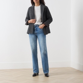 Model wearing Marella melange dark wool coat, styled with white top, light blue straight-leg jeans and black flat shoes.