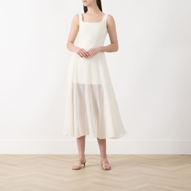Model wearing Marella Sabine Georgette Dress in Wool White, square neckline, sleeveless, semi-sheer midi skirt, styled with gold sandals