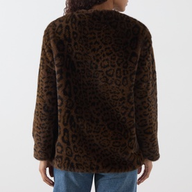 Model wearing Marella jacket in cocoa spotted leopard print faux fur, rear view, relaxed fit with long sleeves.