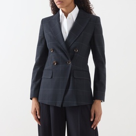 Model wearing Marella navy check double-breasted blazer with gold buttons, styled with white shirt and wide-leg trousers.