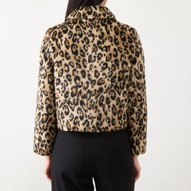 Model wearing Marella Angel Leopard Faux Fur Jacket in Camel Spotted, rear view, paired with black trousers.