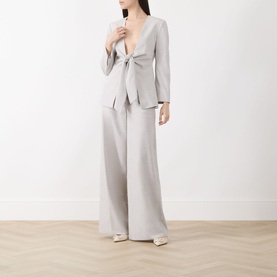 Model wearing Marella Facella Tie-Front Blazer in light grey with wide V-neckline and tie-front detail, styled with matching wide-leg trousers.