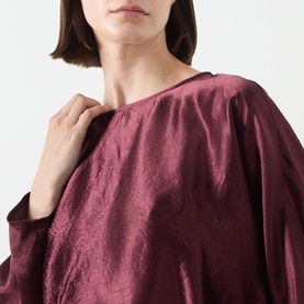 Model wearing Marella bordeaux acetate shirt, wide bateau neckline and relaxed billowing sleeves visible in close-up shot.