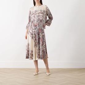 Model wearing Marella Girino Printed Blouse in cream with floral paisley print, three-quarter sleeves, styled with matching printed midi skirt and