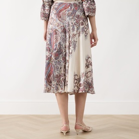 Model wearing Marella Decano Printed Skirt in cream with paisley print, midi length, flared silhouette. Styled with matching printed top and pink