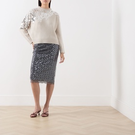 Model wearing Marella medium grey sequin pencil skirt, styled with cream embellished sweater and burgundy heeled mules.