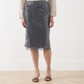 Model wearing Marella medium grey sequin midi skirt with lace hem, styled with cream knit top and brown strappy heels