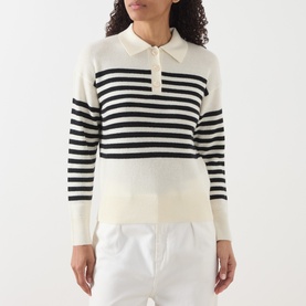 Model wearing Marella cream wool-cashmere polo neck jumper with navy horizontal stripes, long sleeves, and button placket, styled with white trousers.