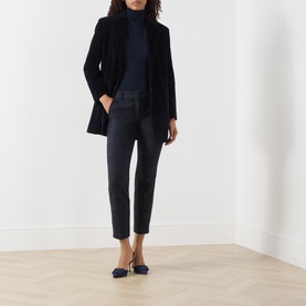 Model wearing Marella Navy Check Trousers with a navy rollneck, navy blazer, and navy slingback heels.