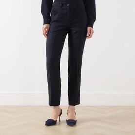 Model wearing Marella Macina Straight Leg Trousers in navy plain with pressed creases, styled with navy heels and dark top.