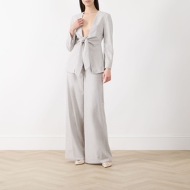 Model wearing Marella Pausa Wide-Leg Trousers in light grey, styled with a matching tie-front blazer and cream heels.