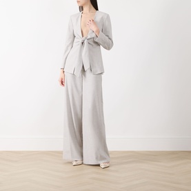 Model wearing Marella Pausa Wide-Leg Trousers in light grey, styled with a matching tie-front blazer and cream heels.