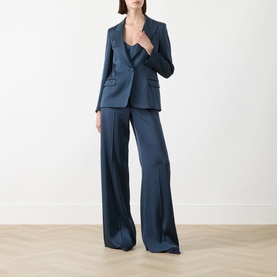 Model wearing Marella Aviation blue wide-leg satin trousers, styled with matching blazer and camisole