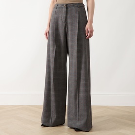 Model wearing Marella Carena Prince of Wales Wide Leg Trousers in grey check, wide-leg silhouette with pressed creases and belt loops visible.