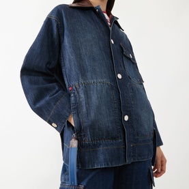 Model wearing Max&Co navy denim coat with button front, chest pockets, and relaxed oversized fit, styled with matching wide-leg denim trousers.