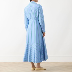 Model wearing Max&Co Ritmo Stripe Shirt Dress in light blue cotton, showing rear view of cinched waist, flared godet skirt and piped trim detail