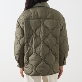 Model wearing khaki quilted overshirt jacket, rear view showing onion-stitch quilted pattern and shirt collar