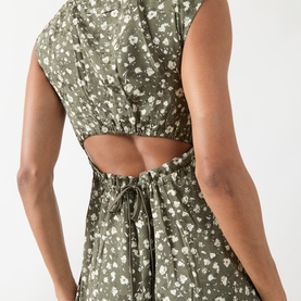 Model wearing Max&Co Virgola Floral Dress in Kaki Print, showing drawstring cut-out back detail on sleeveless midi dress