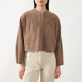 Model wearing Max&Co turtledove collarless cropped goat leather jacket with wide sleeves, styled with cream trousers