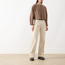 Model wearing Max&Co turtledove leather jacket with collarless neckline, styled with cream wide-leg trousers and black loafers