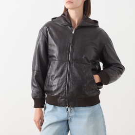 Model wearing Max&Co dark brown leather hooded bomber jacket with ribbed cuffs and hem, styled with light blue jeans.