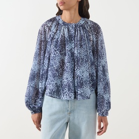 Model wearing Max&Co Ghiglia Printed Blouse in light blue leopard print with raglan balloon sleeves, styled with light blue jeans.