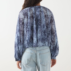 Model wearing Max&Co Ghiglia Printed Blouse in light blue leopard print with balloon sleeves and pleated back, styled with light wash jeans