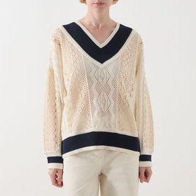 Model wearing Max&Co Pinne Lace Panel Sweater in Milk Bi with navy V-neck trim, pointelle and cable-knit detail, paired with cream trousers