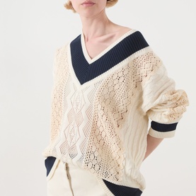 Model wearing Max&Co Pinne Lace Panel Sweater in Milk Bi with navy V-neck trim, pointelle and cable-knit detailing, long sleeves