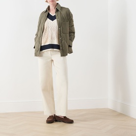 Model wearing Max&Co Pinne Lace Panel Sweater in Milk Bi with navy trim, styled with khaki jacket, cream wide-leg trousers and brown loafers