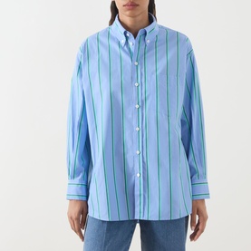 Model wearing Max&Co Dama Stripe Shirt in light blue with green and navy vertical stripes, button-down collar, long sleeves, styled with blue jeans.