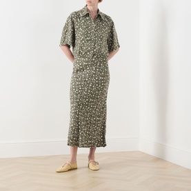 Model wearing Max&Co Agenda Printed Skirt in Kaki Print floral jacquard, midi length, styled with matching shirt and yellow mules