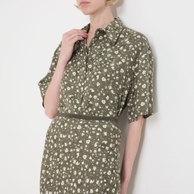 Model wearing Max&Co Agenda Printed Skirt in Kaki Print floral jacquard, midi length, styled with matching printed shirt.