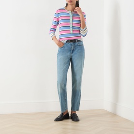 Model wearing Max&Co Giunto Stripe Henley Top in Pink Pinstripes with light-wash straight jeans and black loafers
