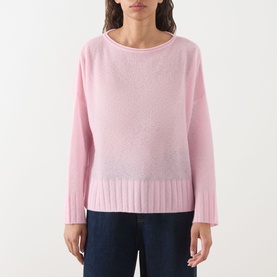 Model wearing Max&Co Stampa Knit Sweater in Pink Plain, featuring a boat neckline, dropped shoulders, and ribbed trims, styled with dark jeans.