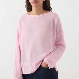 Model wearing Max&Co Stampa Knit Sweater in pink, featuring boat neckline, dropped shoulders and ribbed trims, styled with dark jeans.