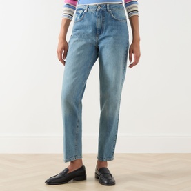 Model wearing Max&Co navy denim straight-leg jeans in cotton, styled with black loafers and a striped knit top.