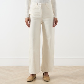 Model wearing Max&Co milk wide-leg cotton trousers with high waist and button detail, styled with white top and tan loafers
