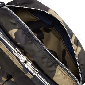 Porter Yoshida bag in woodland khaki camouflage nylon, open zip detail showing navy blue interior lining with silver-tone hardware.